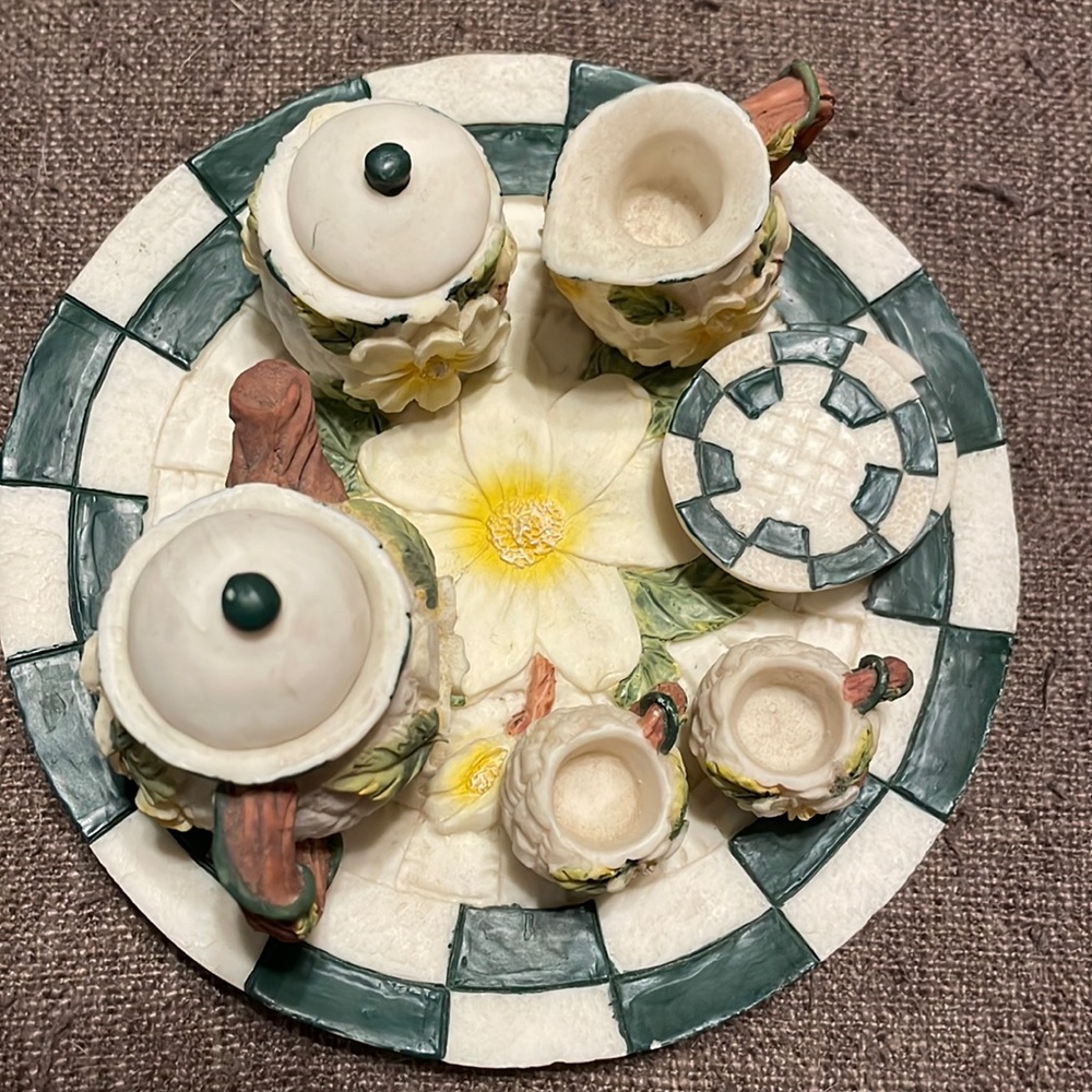 Green checkered miniature t cup set. Magnolia flower on center of plate.